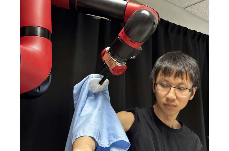 Robotic-assisted dressing system accommodates different poses, body types and garments